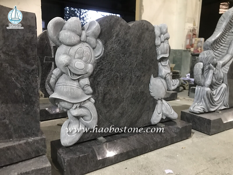 granite cartoon carved headstone